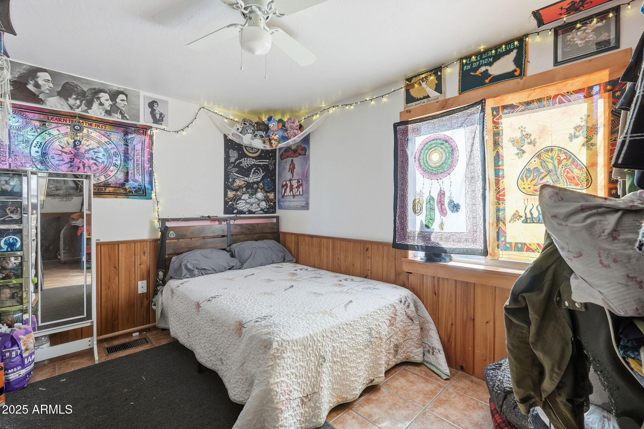 401 South Mariposa Street Payson, AZ 85541 - Photo 17 of 39 a bedroom with a bed and a chandelier