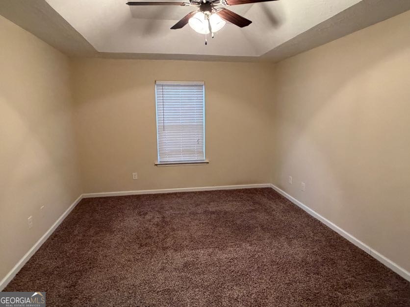 187 Buckhaven Way Statesboro, GA 30458 - Photo 15 of 20 an empty room with a window and a fan