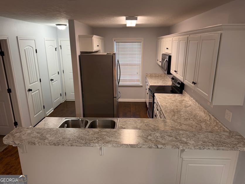 187 Buckhaven Way Statesboro, GA 30458 - Photo 4 of 20 a kitchen with stainless steel appliances granite countertop a refrigerator and a sink