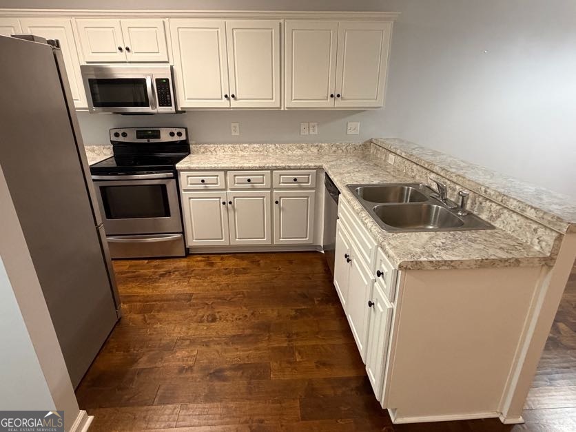 187 Buckhaven Way Statesboro, GA 30458 - Photo 5 of 20 a kitchen with white cabinets sink and stainless steel appliances
