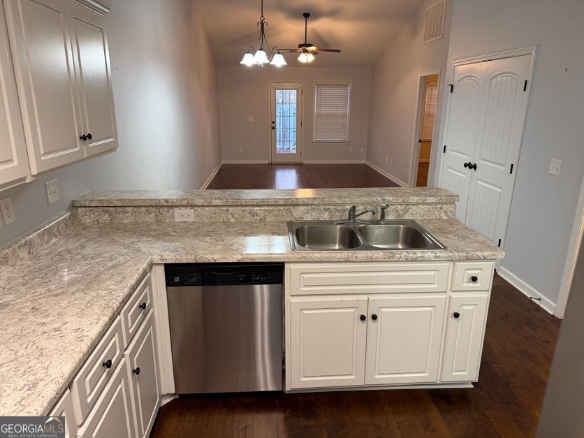 187 Buckhaven Way Statesboro, GA 30458 - Photo 7 of 20 a kitchen with granite countertop a stove sink and cabinets