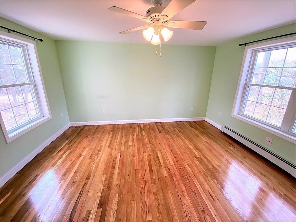 390 Marrett Road Lexington, MA 02421 - Photo 5 of 11 wooden floor in an empty room with a window