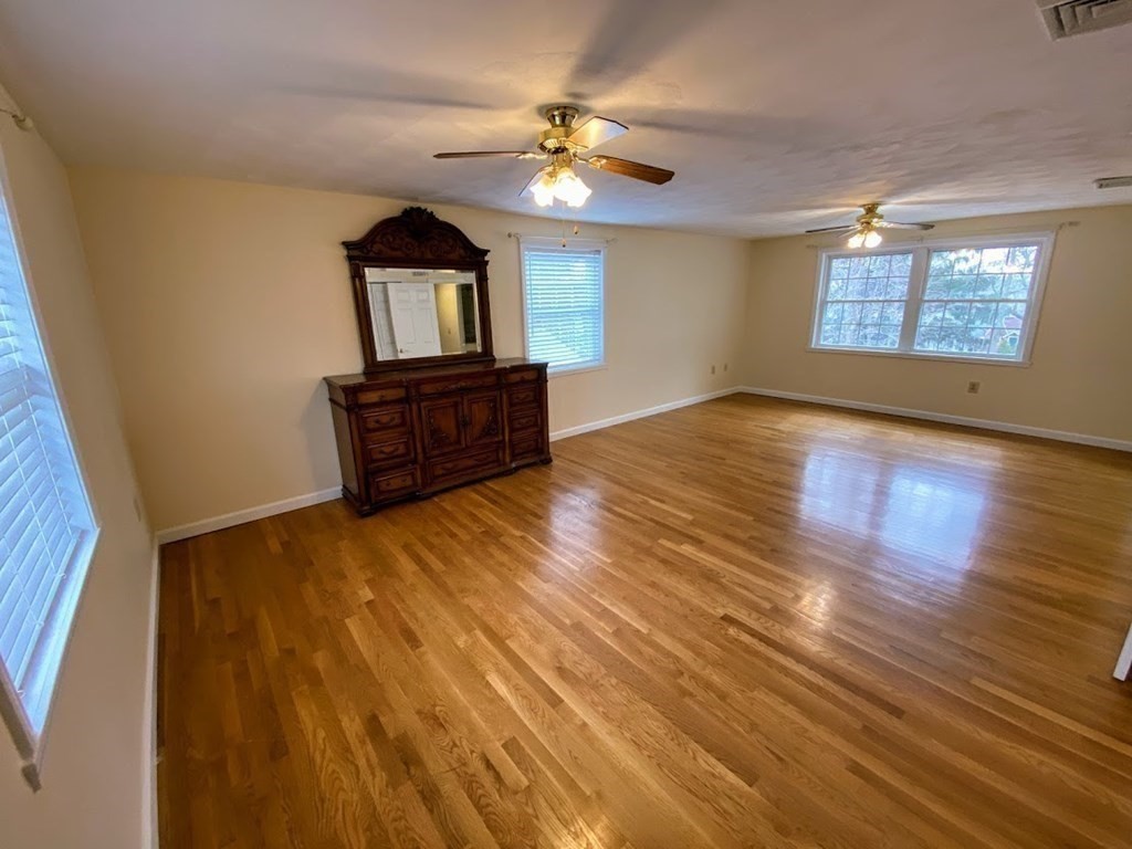 390 Marrett Road Lexington, MA 02421 - Photo 8 of 11 wooden floor in an empty room with a window