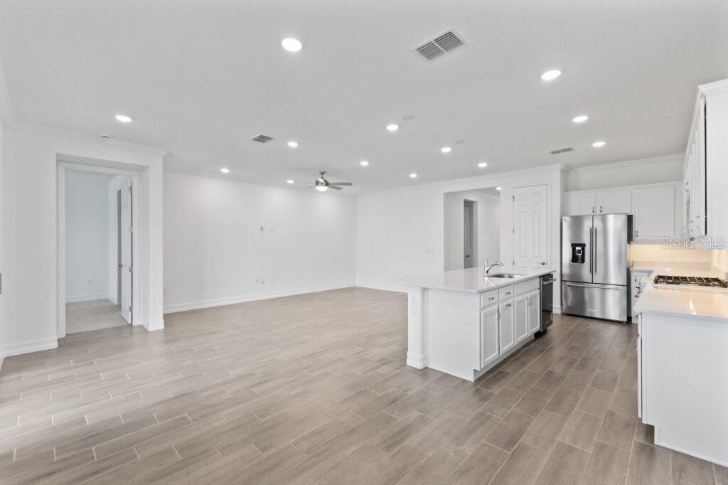 3223 Northwest 52nd Avenue Road Ocala, FL 34482 - Photo 12 of 25 a view of kitchen with kitchen island wooden floor center island and stainless steel appliances