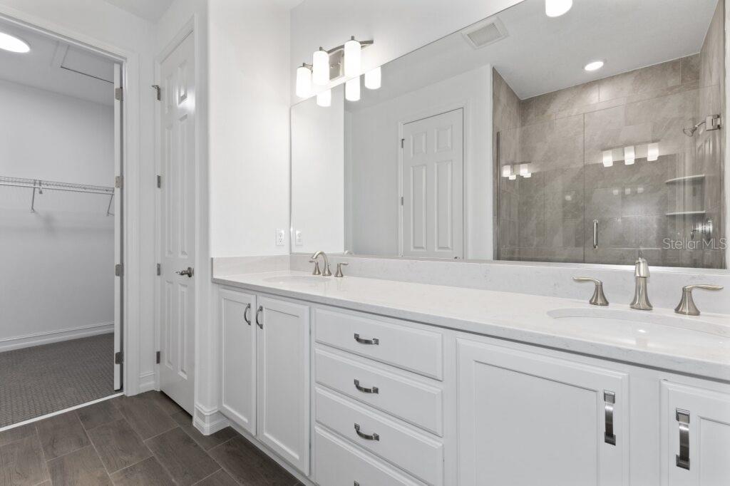 3223 Northwest 52nd Avenue Road Ocala, FL 34482 - Photo 18 of 25 a bathroom with double vanity sink and a mirror