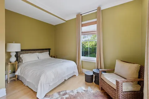 a living room with furniture pool table and a flat screen tv