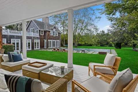 a view of a patio with a yard
