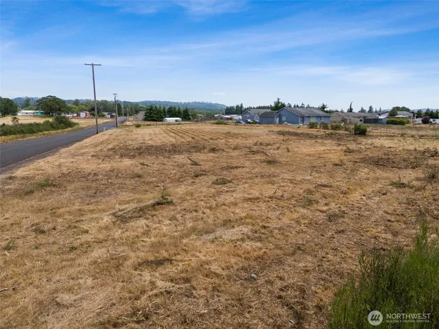 a view of a lake with houses in the back