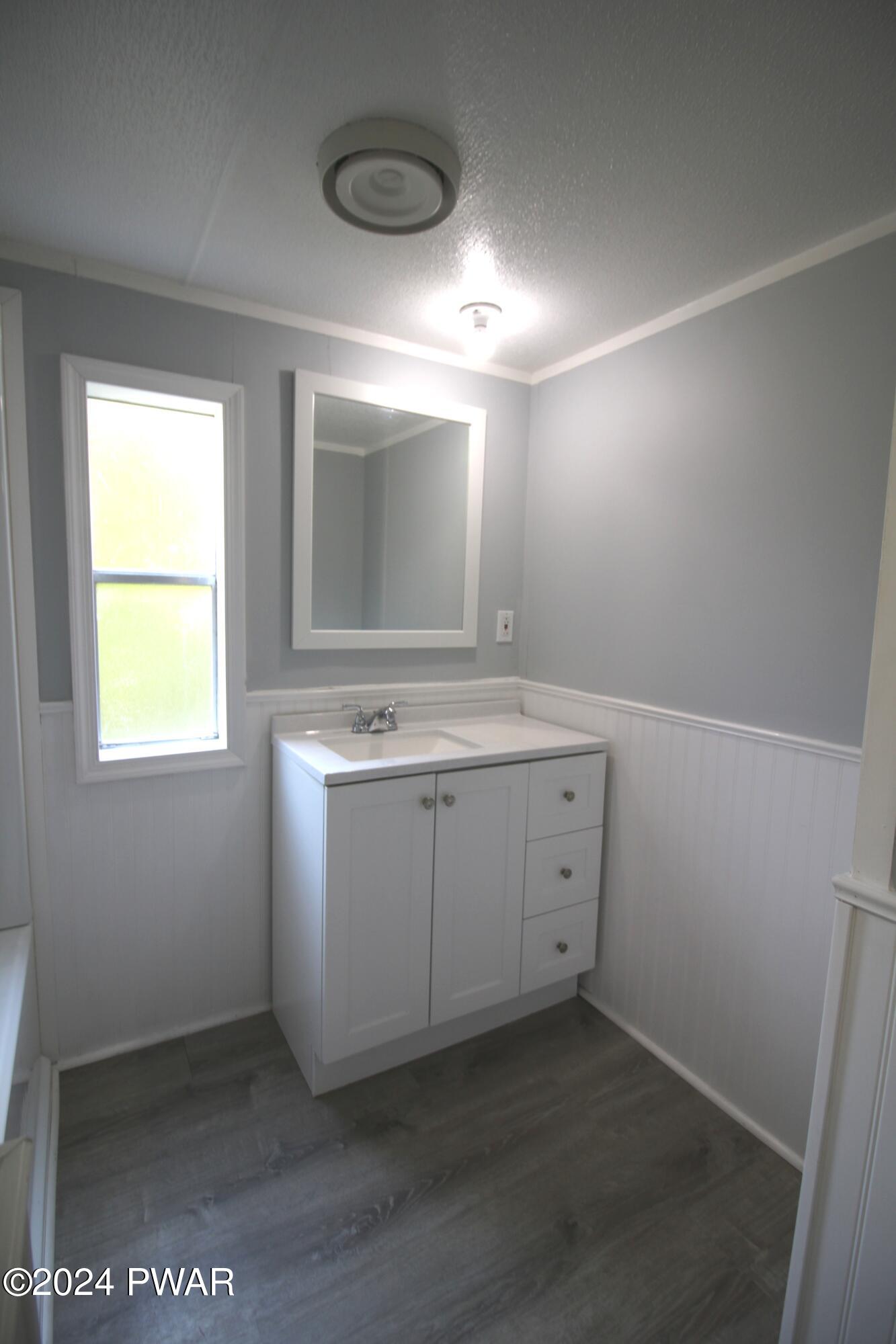 77 Pond Road Lake Ariel, PA 18436 - Photo 21 of 36 a room with a stove and a mirror
