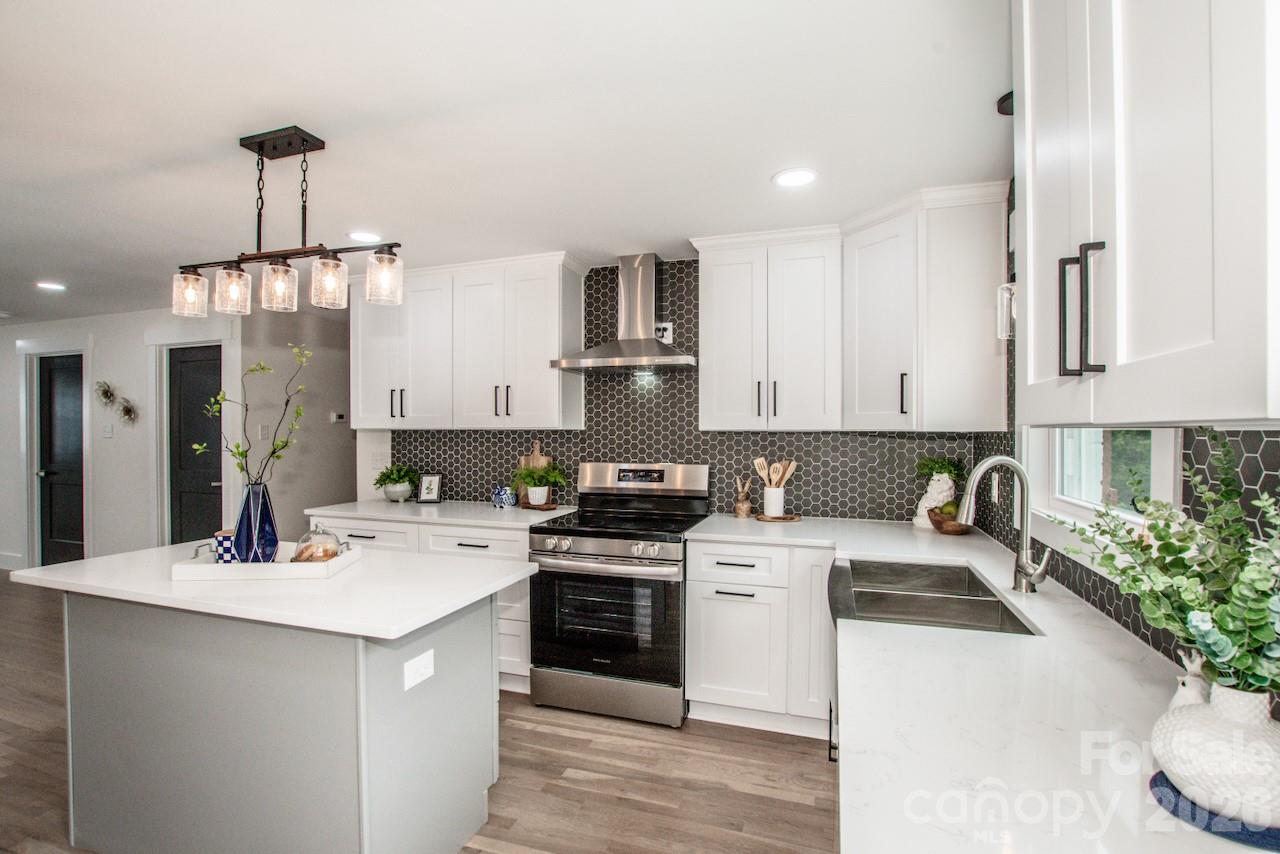 6229 Mountain Grove Road Hickory, NC 28602 - Photo 12 of 41 a kitchen with a sink stove and refrigerator