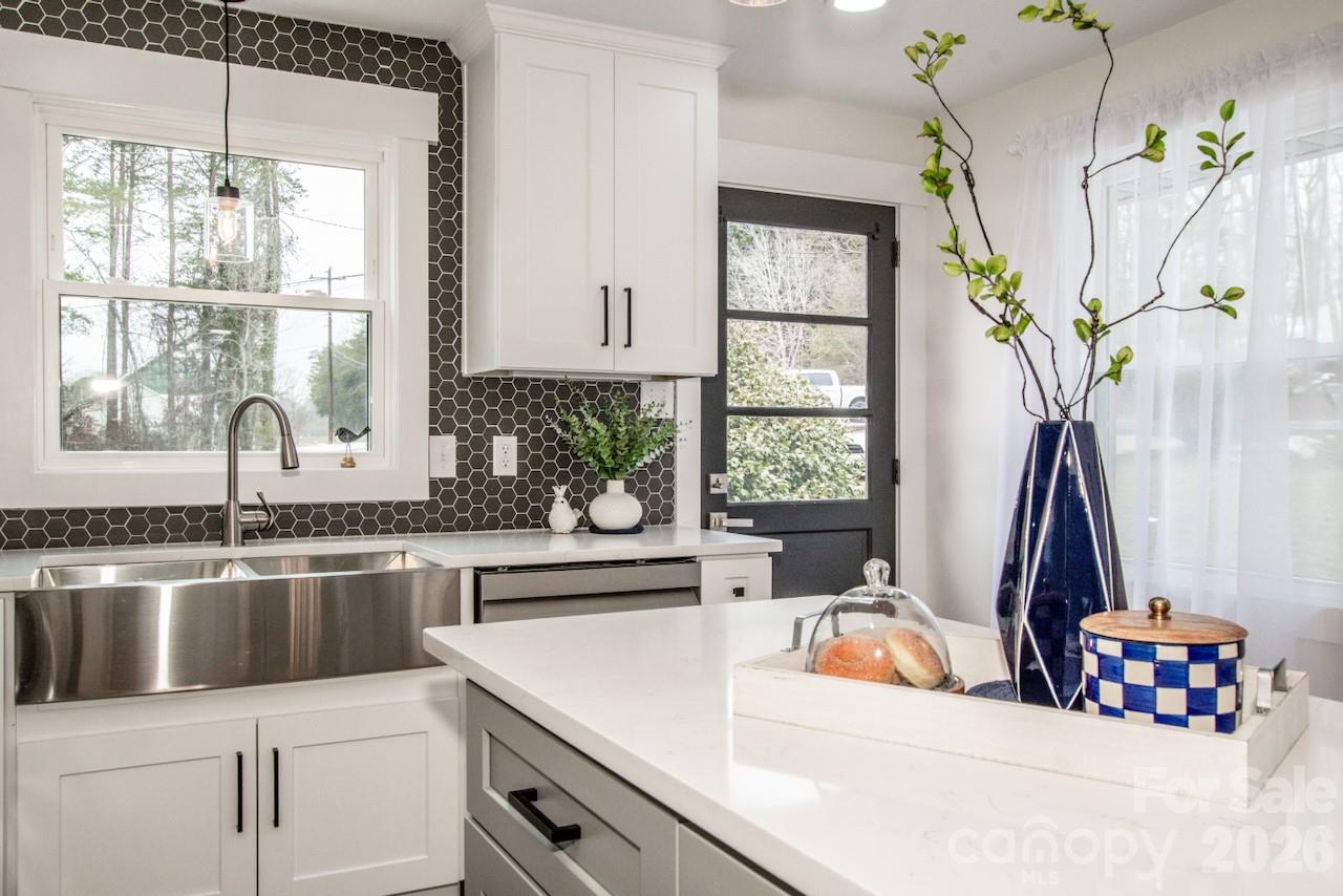 6229 Mountain Grove Road Hickory, NC 28602 - Photo 16 of 41 a kitchen with a window sink and wooden floor