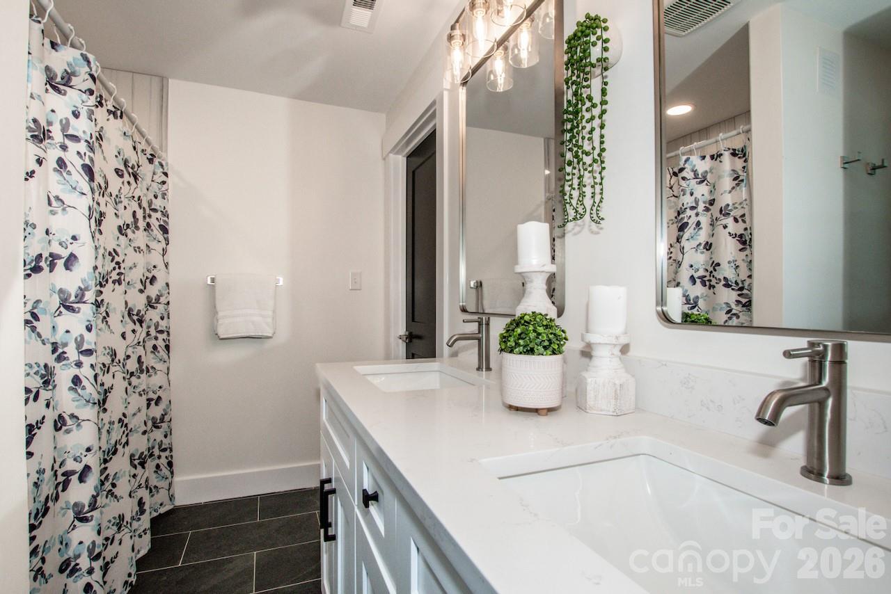 6229 Mountain Grove Road Hickory, NC 28602 - Photo 21 of 41 a bathroom with a sink and a mirror