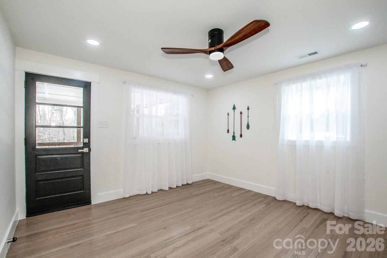 6229 Mountain Grove Road Hickory, NC 28602 - Photo 22 of 41 wooden floor in an empty room with a window