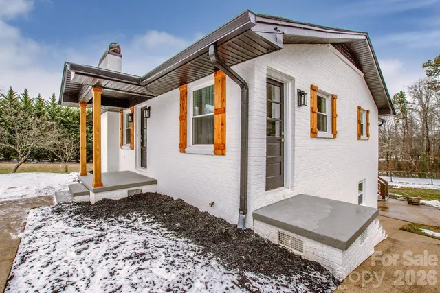 a bathroom with double vanity sink and mirror