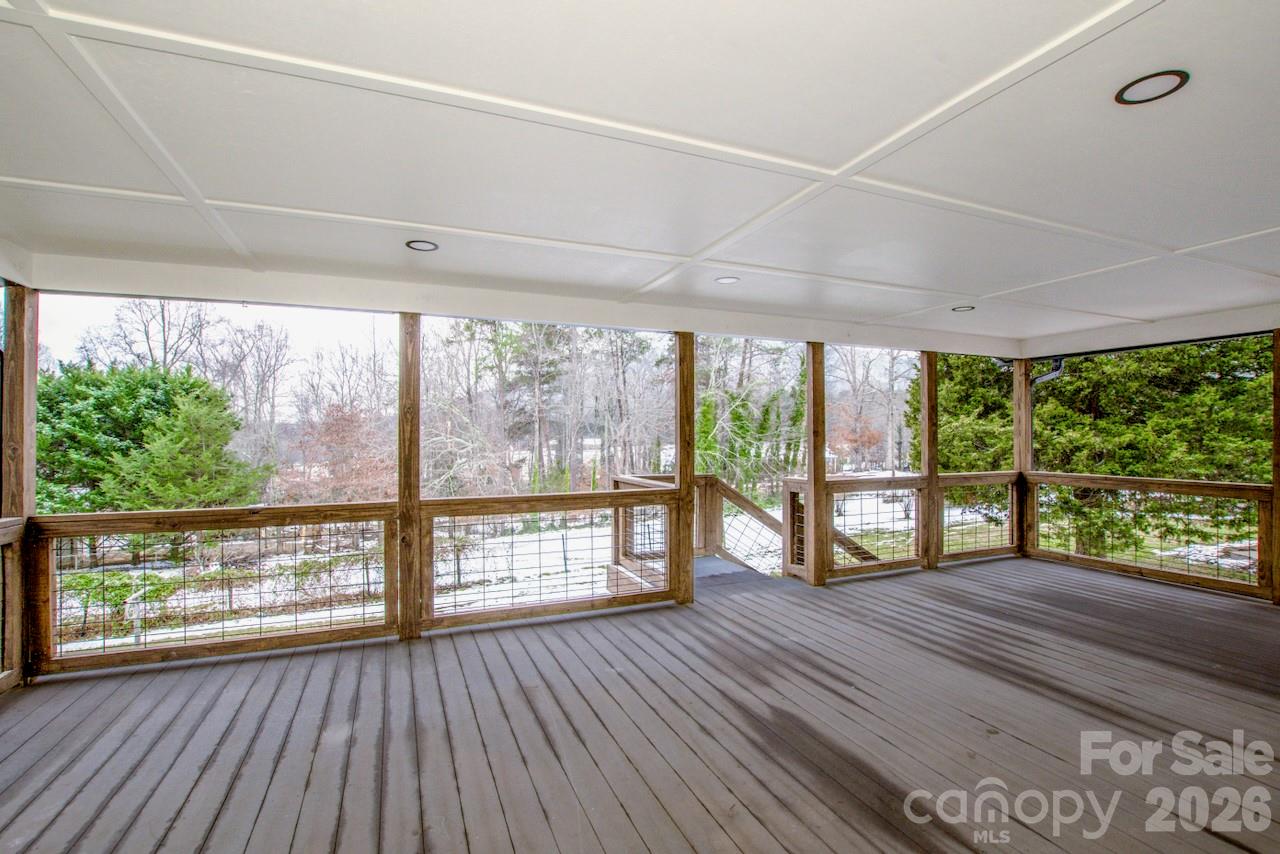 6229 Mountain Grove Road Hickory, NC 28602 - Photo 32 of 41 an empty room with wooden floor and large windows