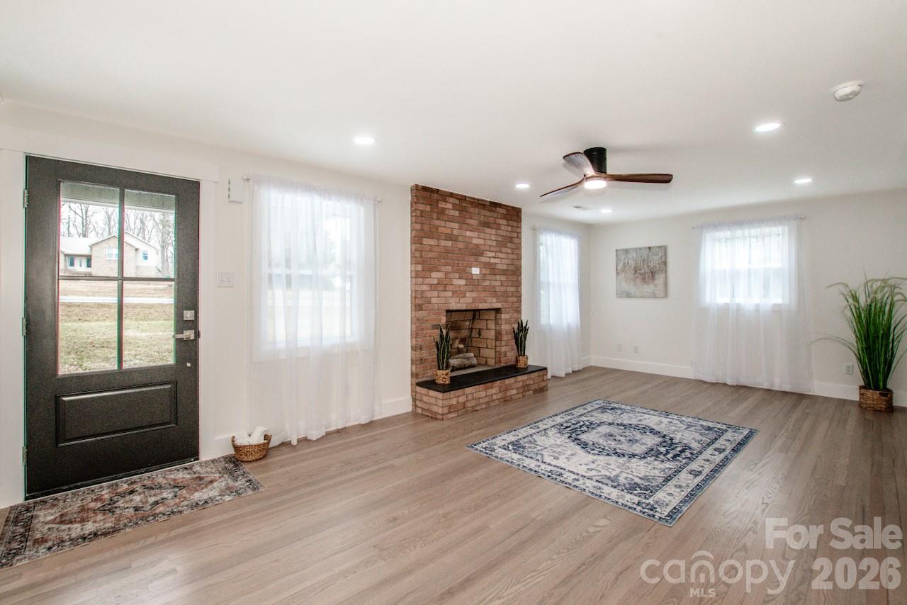 6229 Mountain Grove Road Hickory, NC 28602 - Photo 7 of 41 a view of an empty room with window and wooden floor