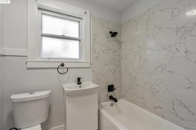 a bathroom with a sink a toilet and a bathtub