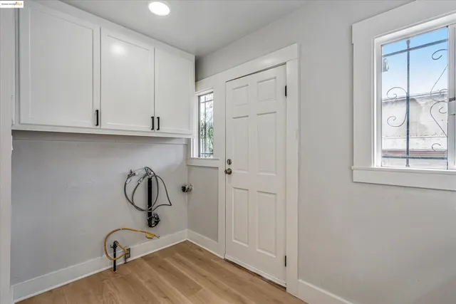 a view of a storage and utility room with window