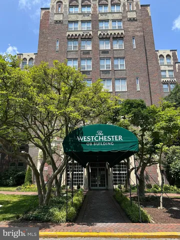 a sign that is on a brick building