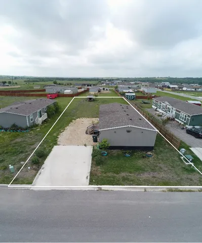 an aerial view of a house with a garden