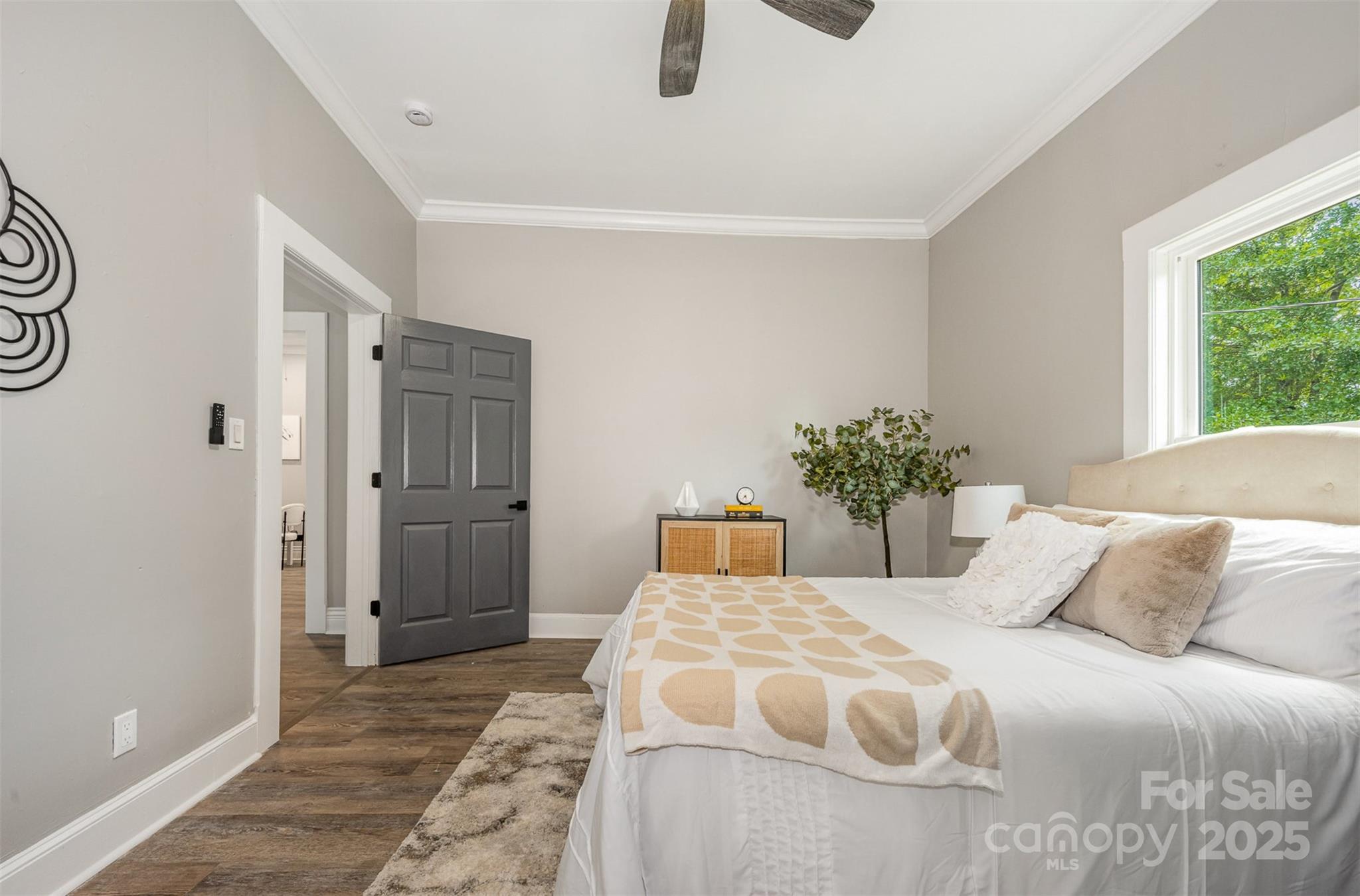 201 Valley Street Stanley, NC 28164 - Photo 12 of 25 a bedroom with a large bed and a potted plant
