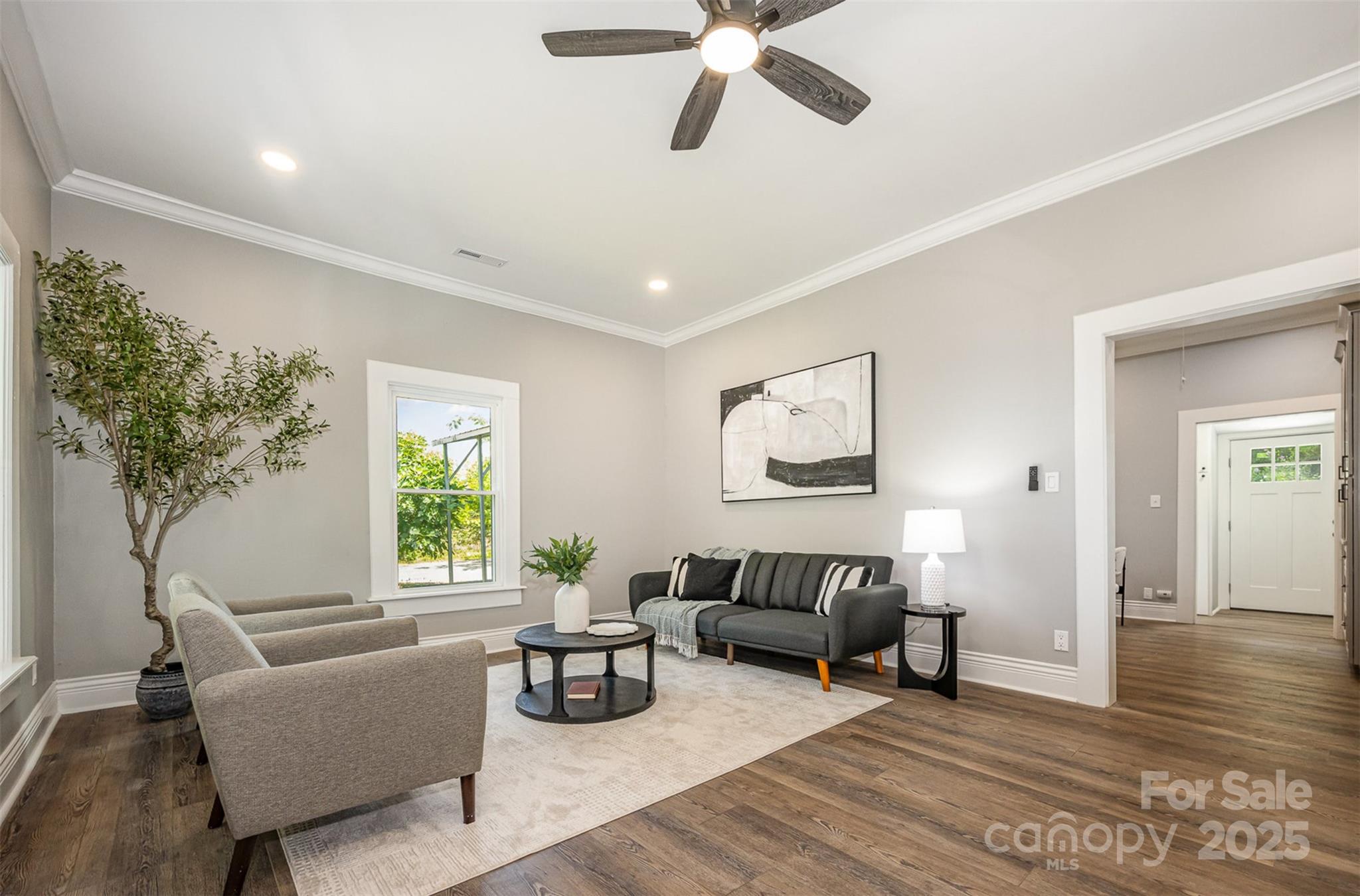 201 Valley Street Stanley, NC 28164 - Photo 7 of 25 a living room with furniture and a potted plant