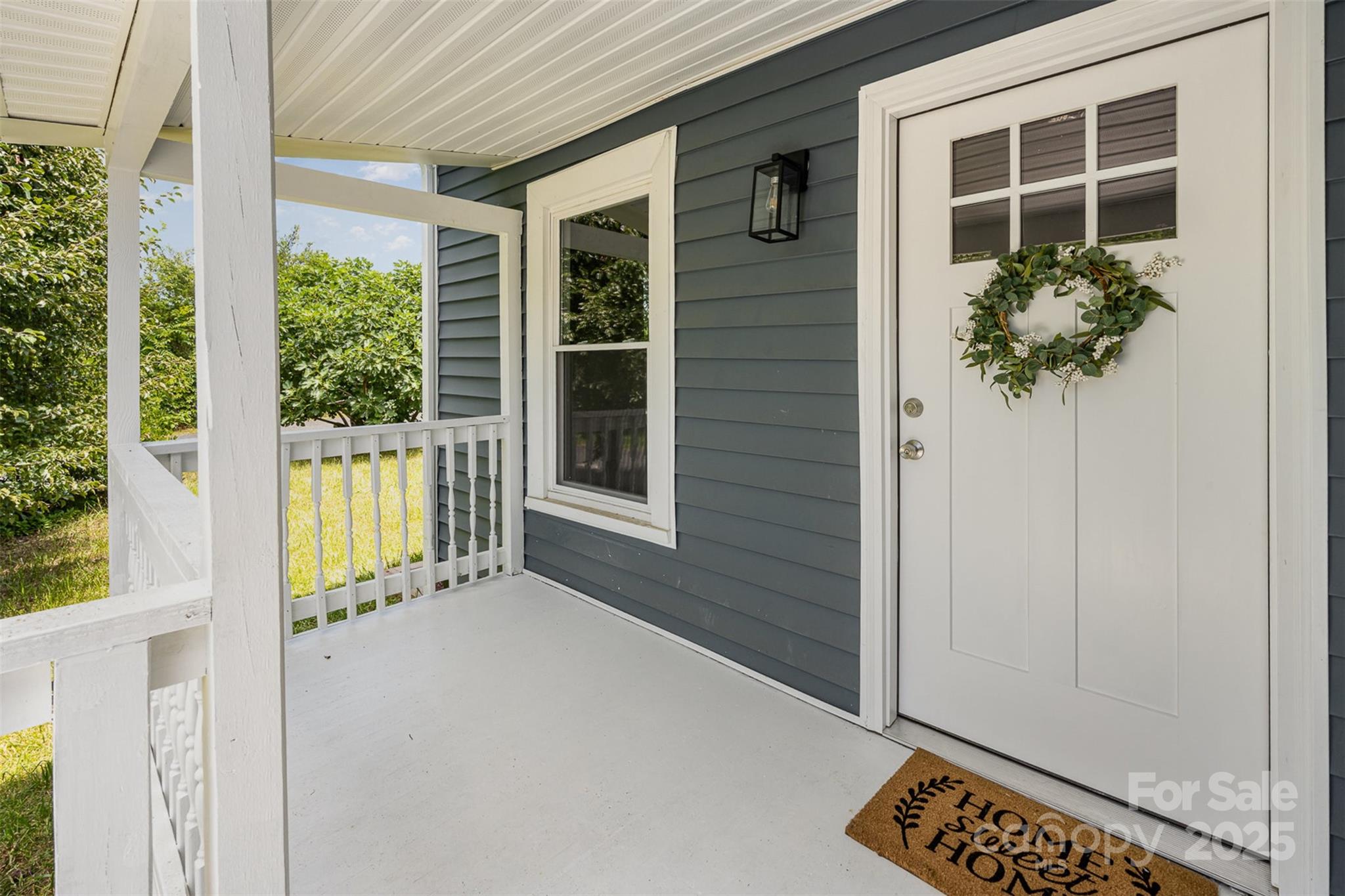 201 Valley Street Stanley, NC 28164 - Photo 10 of 25 a view of a house with a flower garden