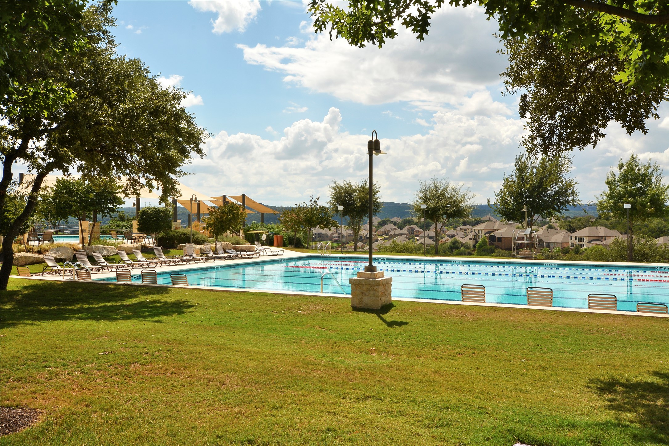 3513 Grimes Ranch Road Austin, TX 78732 - Photo 22 of 32 Community pool featuring a yard