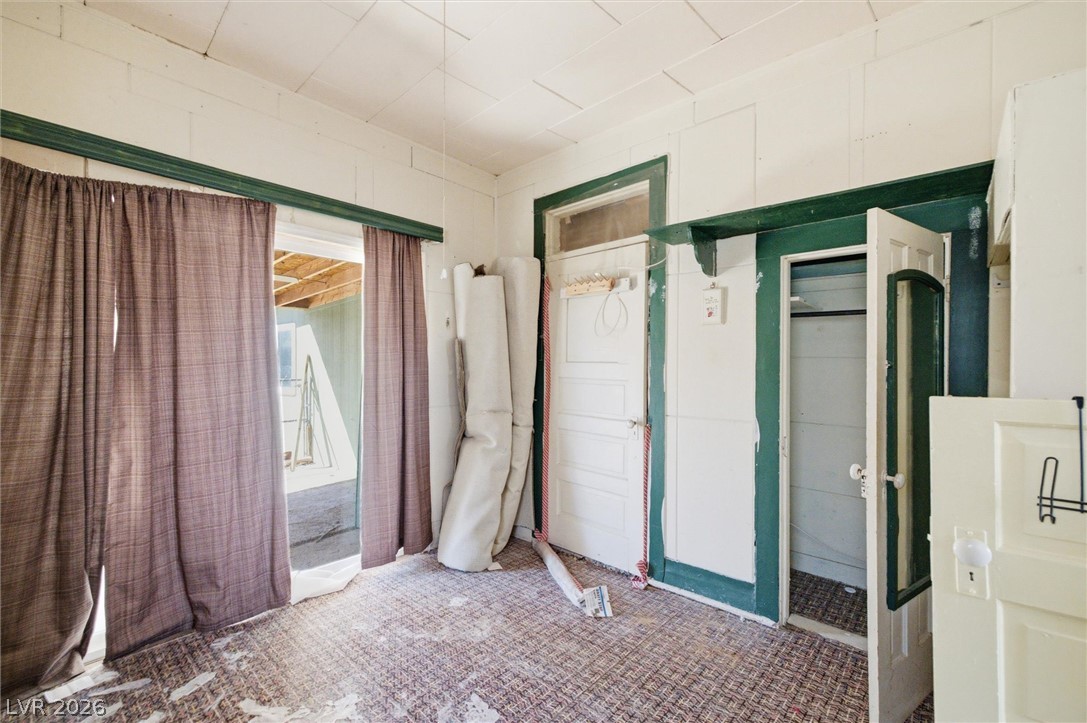 405 Main Street Beatty, NV 89003 - Photo 13 of 28 A well-lit room awaits your personal touch, featuring classic architectural details and an inviting outdoor view.