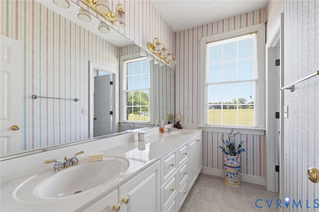15441 Goshen Road Montpelier, VA 23192 - Photo 29 of 47 a spacious bathroom with a sink a bathtub and a window