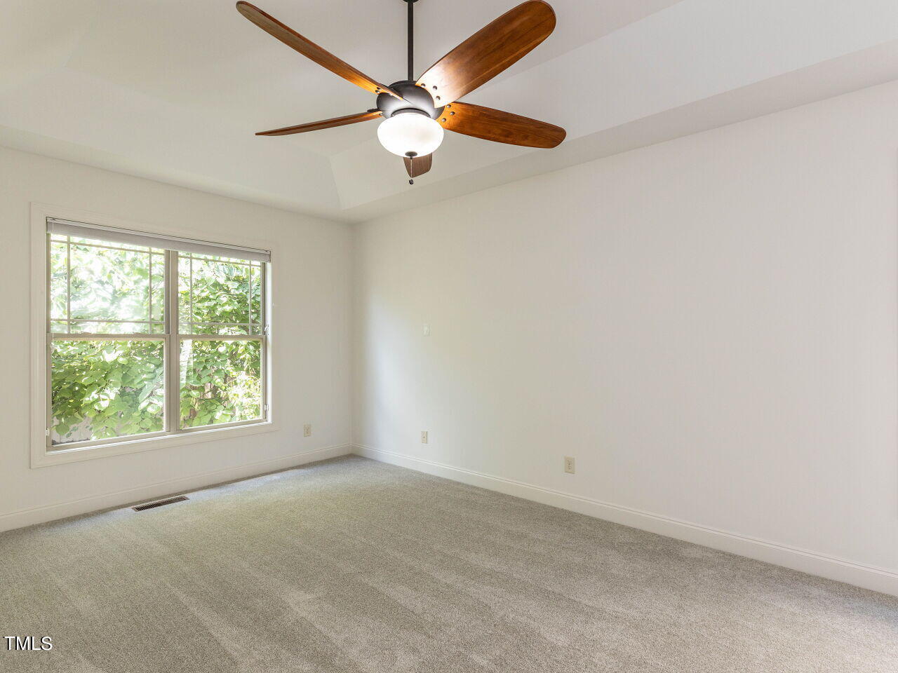 1805 Stonebanks Loop Cary, NC 27518 - Photo 13 of 27 an empty room with a window and a fan
