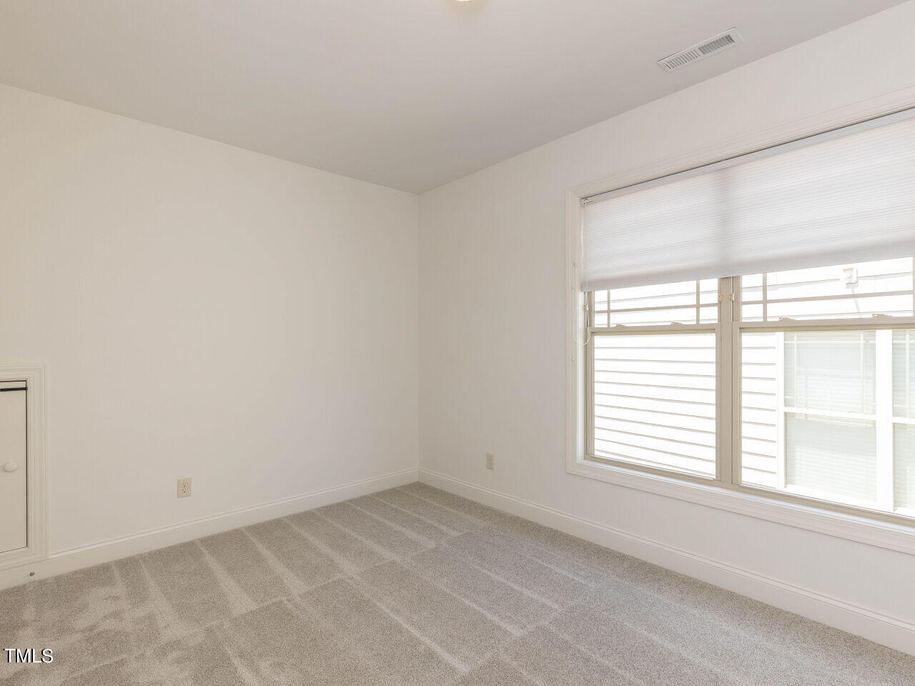 1805 Stonebanks Loop Cary, NC 27518 - Photo 20 of 27 an empty room with a window
