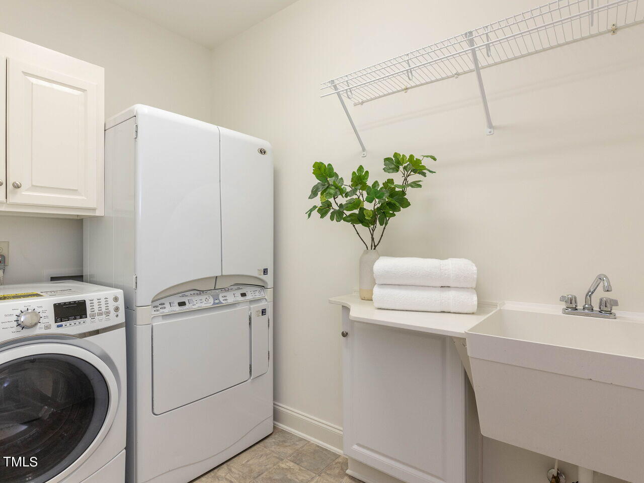 1805 Stonebanks Loop Cary, NC 27518 - Photo 21 of 27 a utility room with dryer and washer