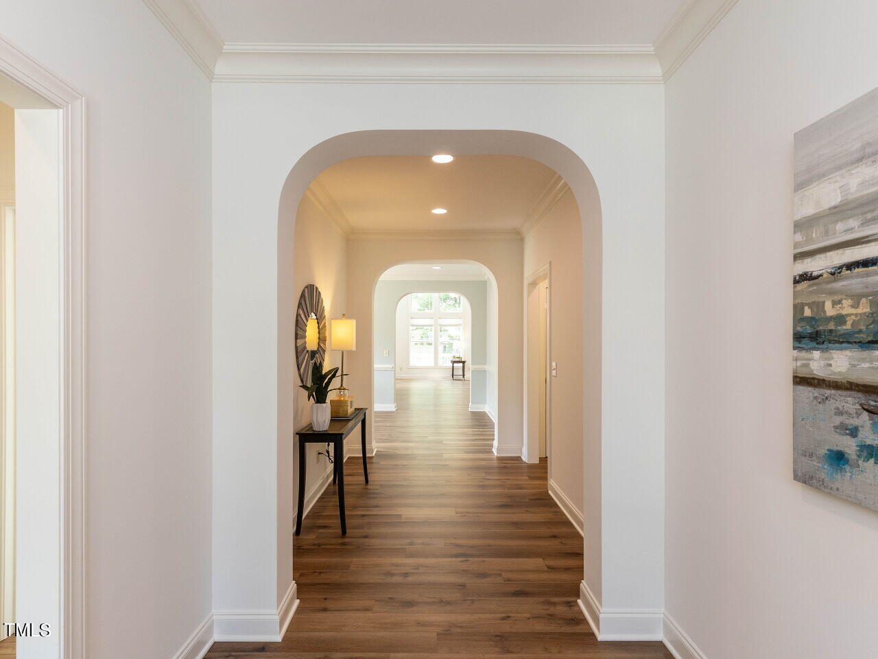 1805 Stonebanks Loop Cary, NC 27518 - Photo 4 of 27 a view of a livingroom with wooden floor and furniture