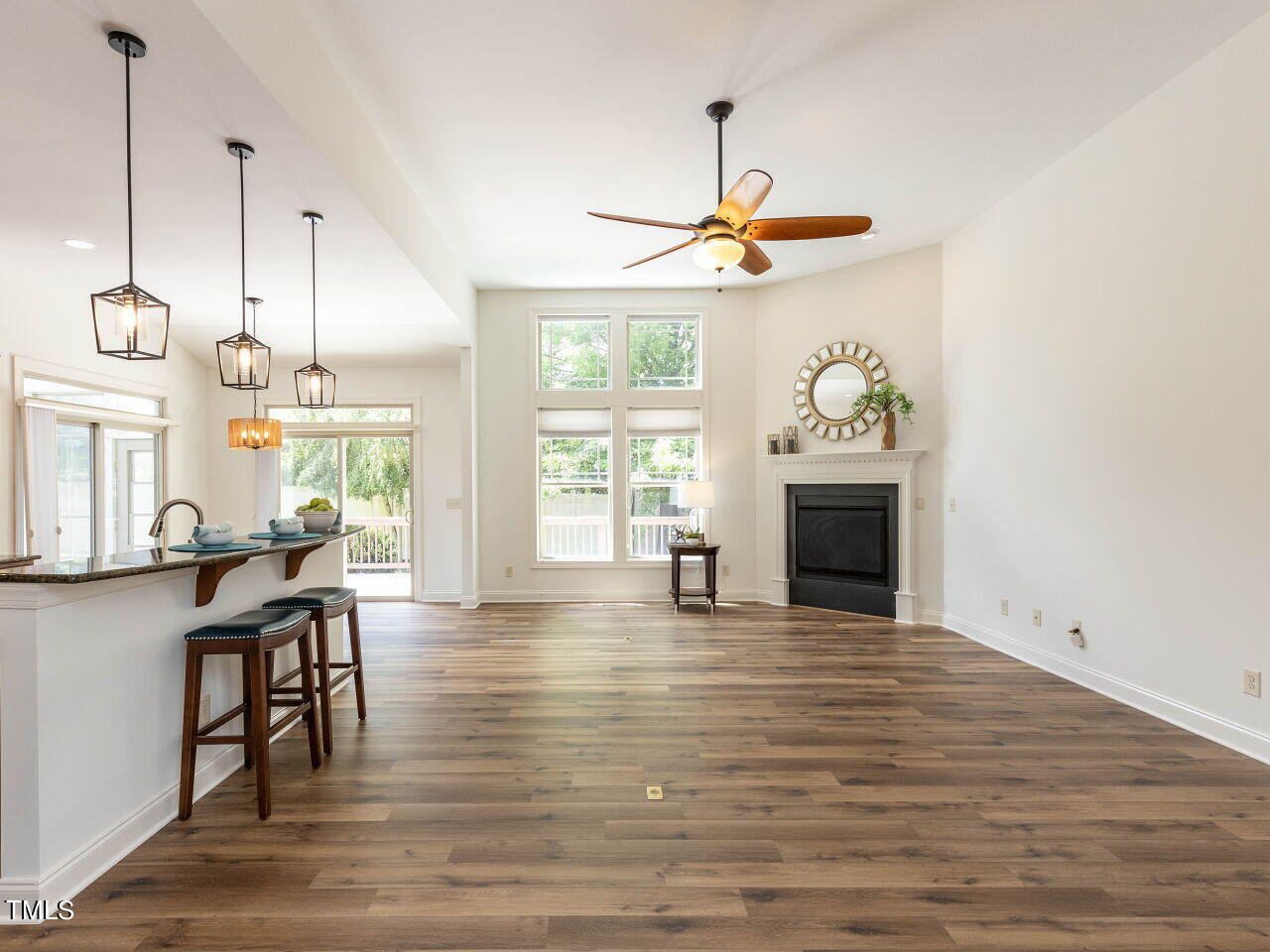 1805 Stonebanks Loop Cary, NC 27518 - Photo 7 of 27 a view of a livingroom with furniture window and wooden floor