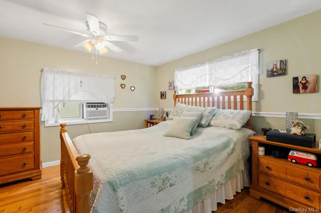 a bedroom with a bed and a dresser in it