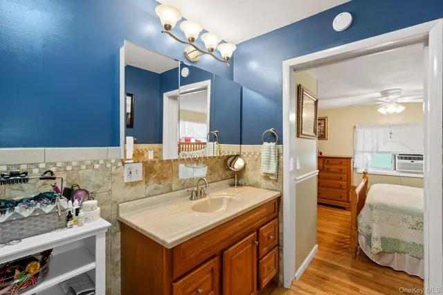 a bathroom with a sink and a mirror