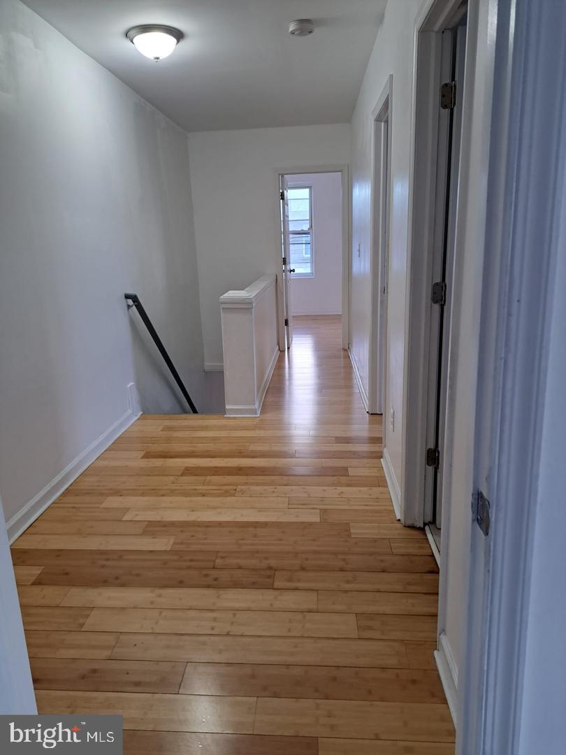 5835 Arch Street Philadelphia, PA 19139 - Photo 14 of 21 a view of a hallway with wooden floor