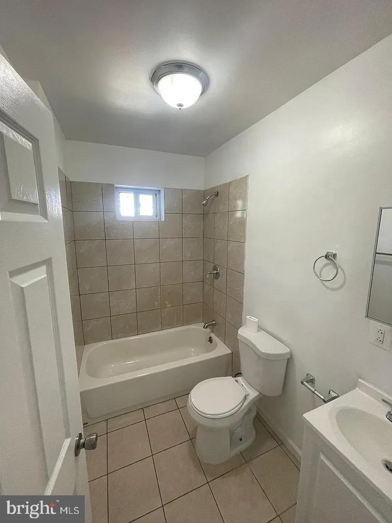 5835 Arch Street Philadelphia, PA 19139 - Photo 18 of 21 a bathroom with a bathtub and toilet