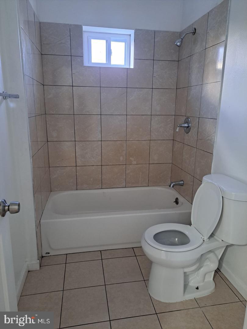 5835 Arch Street Philadelphia, PA 19139 - Photo 19 of 21 a bathroom with a toilet and a shower