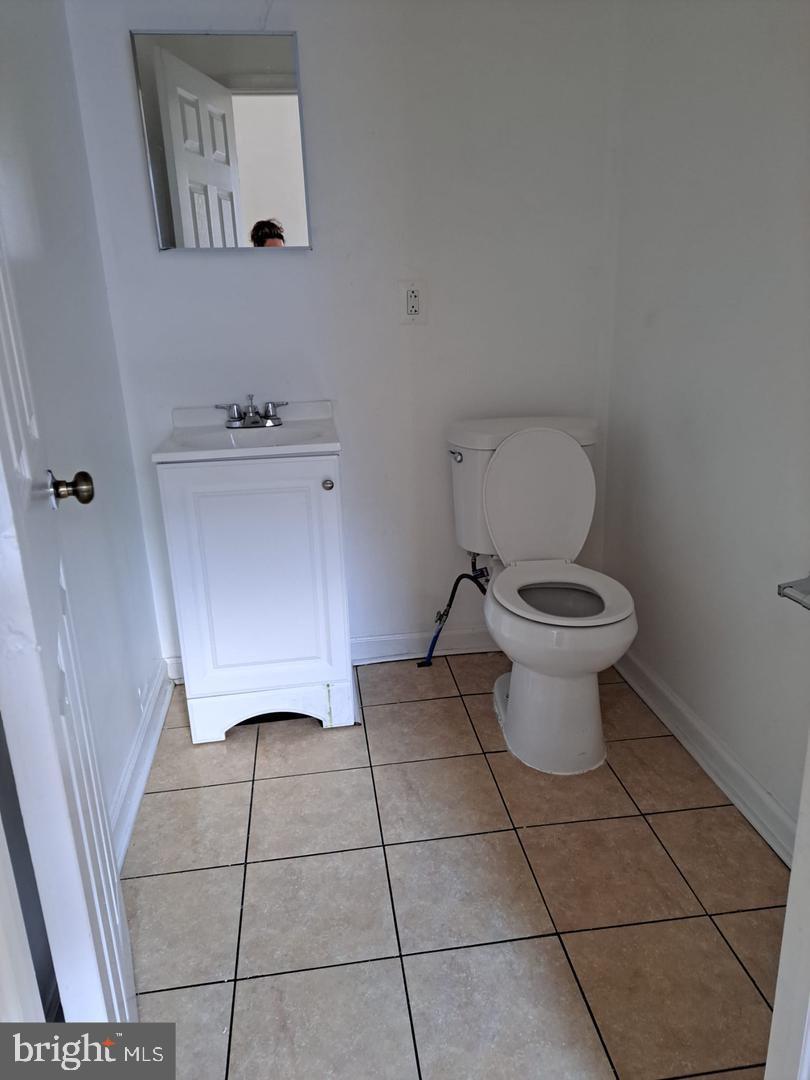 5835 Arch Street Philadelphia, PA 19139 - Photo 20 of 21 a bathroom with a toilet and a sink
