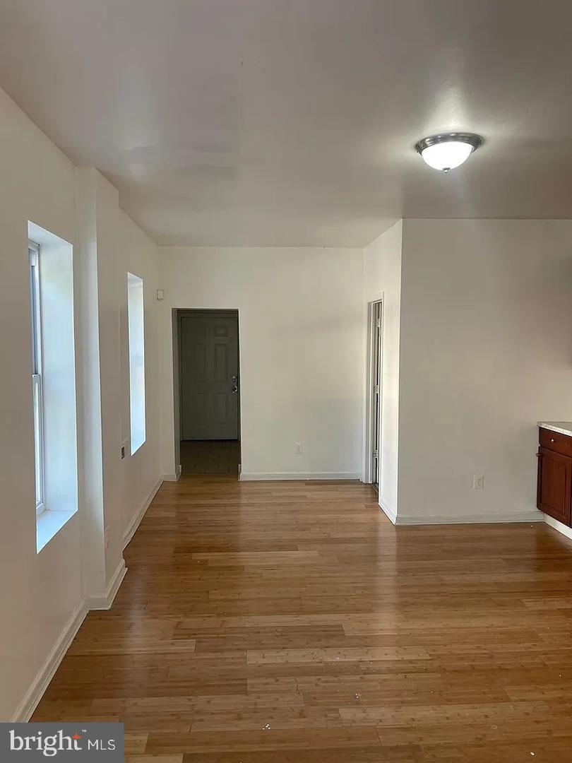 5835 Arch Street Philadelphia, PA 19139 - Photo 4 of 21 a view of an empty room with wooden floor and closet