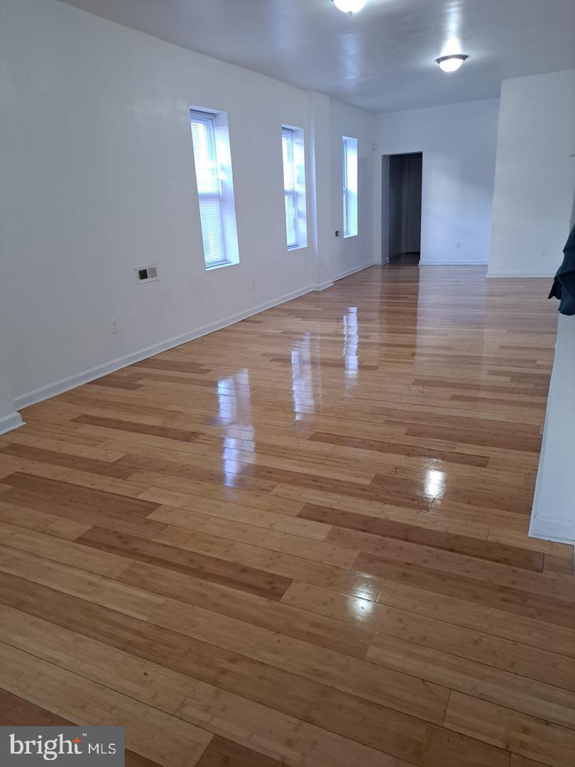 5835 Arch Street Philadelphia, PA 19139 - Photo 5 of 21 a view of an empty room with wooden floor