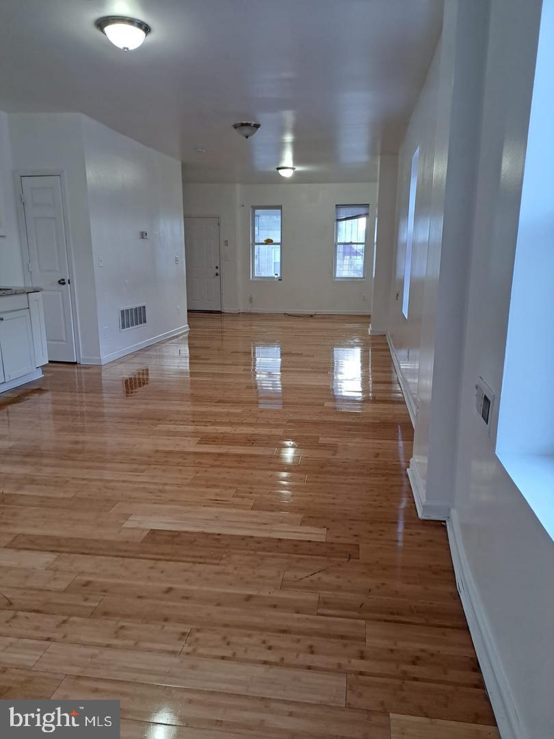 5835 Arch Street Philadelphia, PA 19139 - Photo 6 of 21 a view of entryway and hall with wooden floor