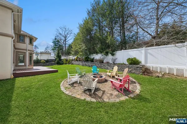 an aerial view of a house with swimming pool and garden space