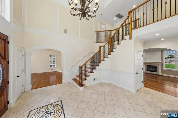 a view of hallway with wooden floor