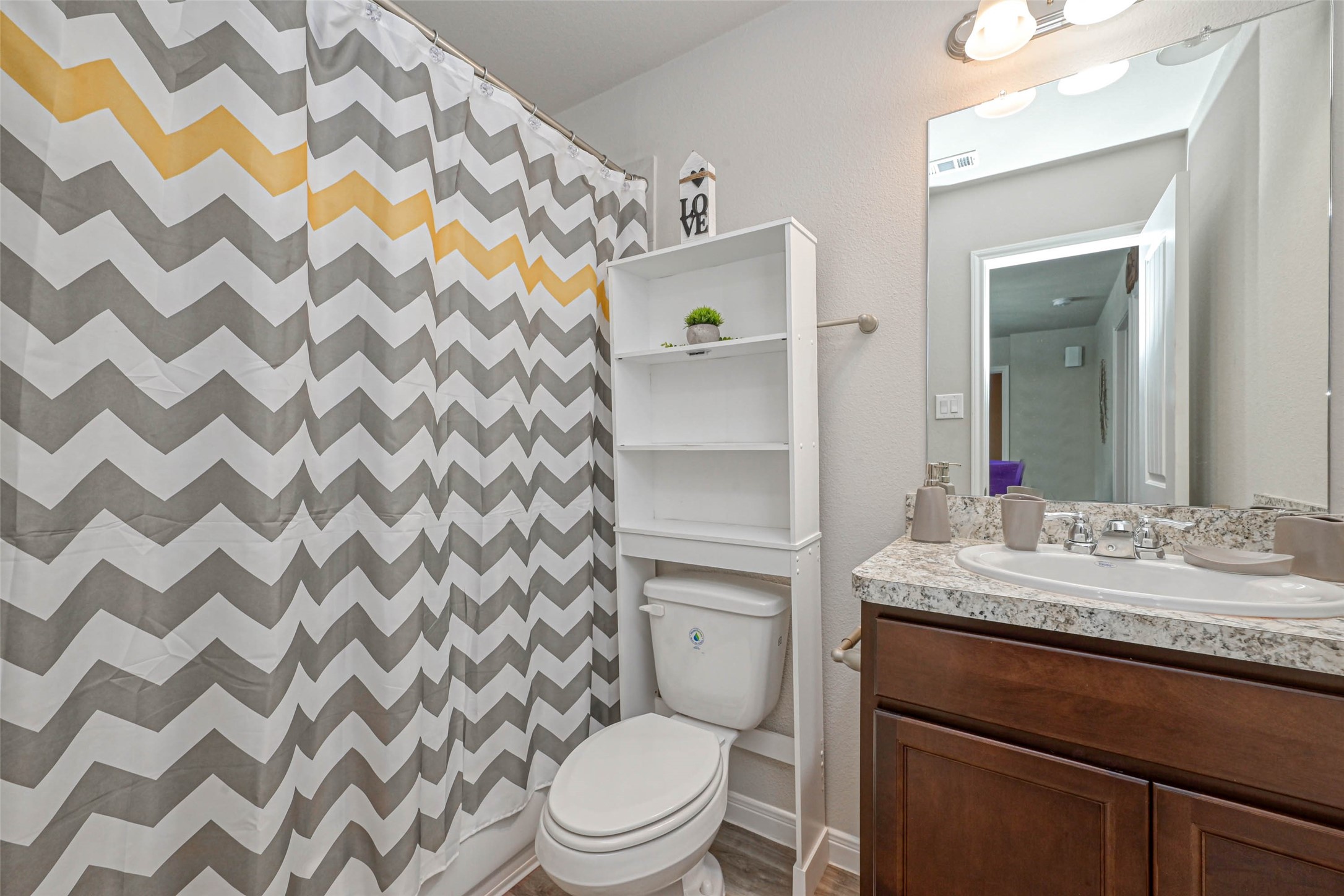 9722 Cargill Street Houston, TX 77029 - Photo 12 of 20 Guest Bathroom with single vanity and shower/tub combo