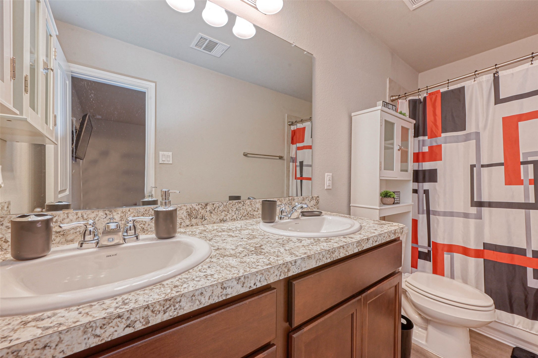 9722 Cargill Street Houston, TX 77029 - Photo 16 of 20 Primary Bath boasts a large double sink vanity with an over sized mirror