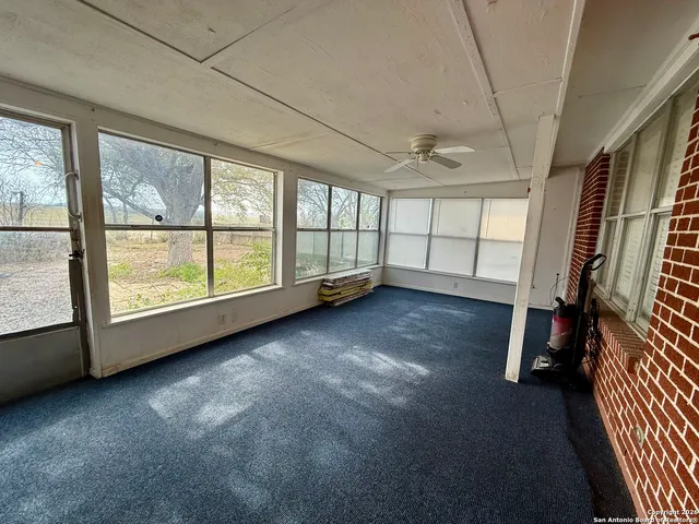 an empty room with windows