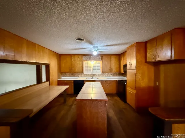 a view of outdoor space with wooden floor